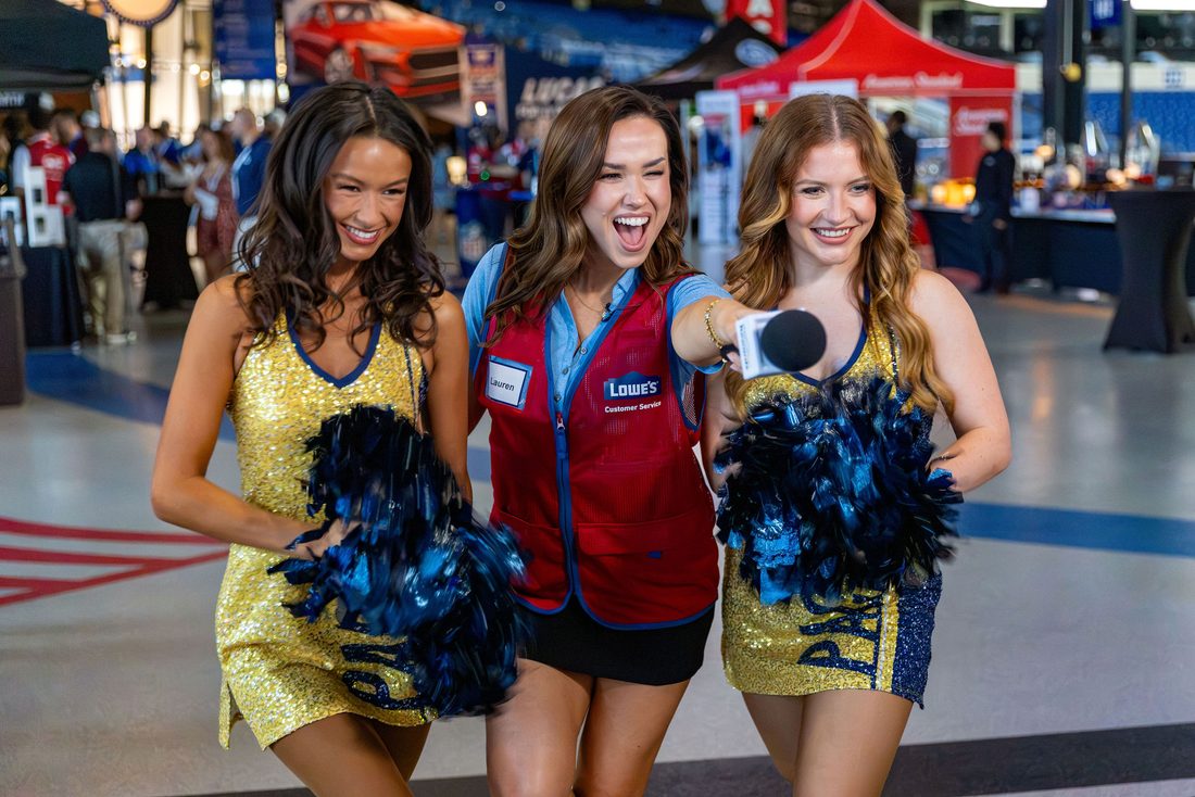 Cheerleaders interviewing Lowe's staff at an Insider Event