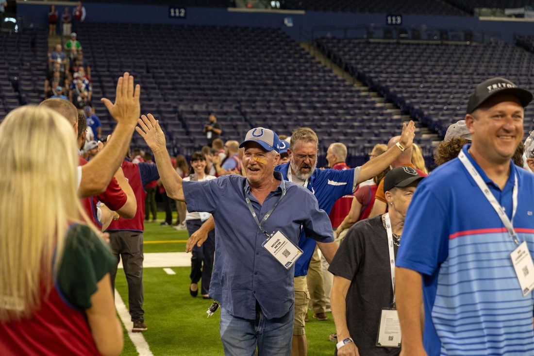 Pros celebrating on the field at an Insider Event